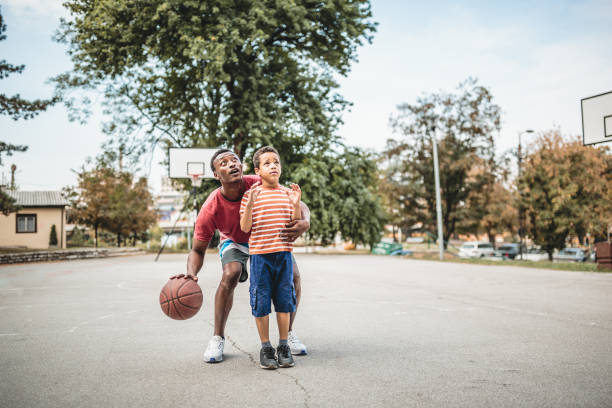 istock Father and son playing basketball 1397757111