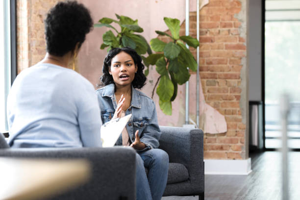istock Young woman talks to her doctor 1397757286