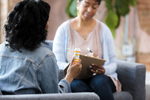 istock Unrecognizeable woman holding medication bottle 1397757297