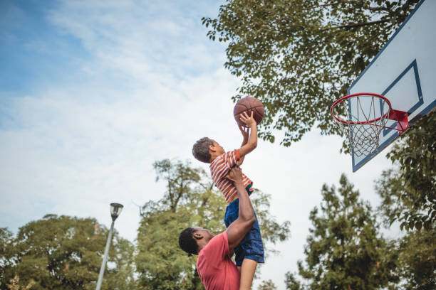 istock Father and son playing basketball 1397757301