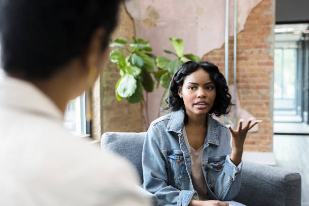 istock Young adult woman gesturing while talking 1397757325