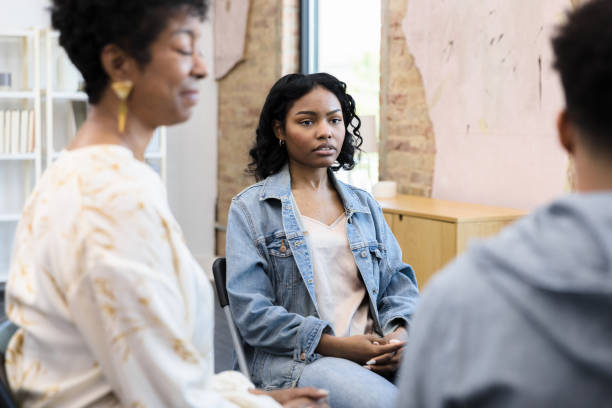istock Young woman listens intently to her peer 1397757327