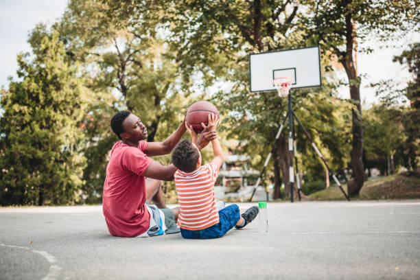 istock Father and son playing basketball 1397757437