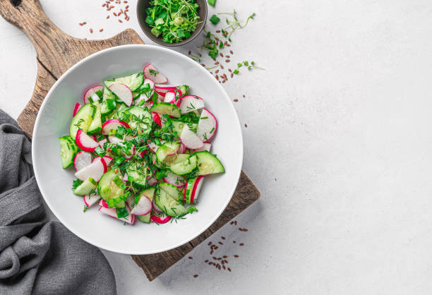 istock Summer vegetable salad with radishes on a gray background. 1397757526