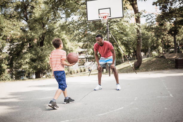 istock Father and son playing basketball 1397757587