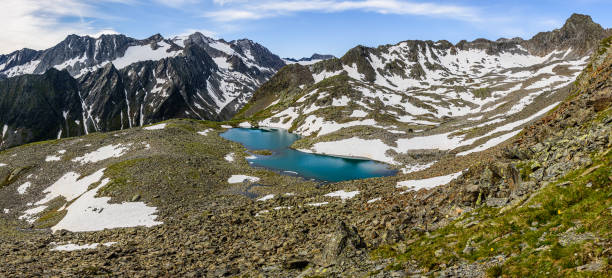 An alpine lake Rinnensee in Stubai Alps. An alpine lake Rinnensee in Stubai Alps. neustift im stubaital stock pictures, royalty-free photos & images