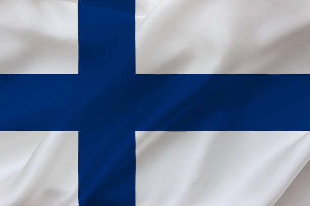 istock Flag of Finland on waving silk background. Fabric texture design. 1397759104