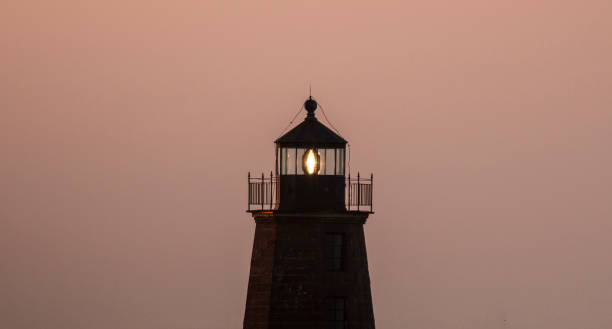 istock Top of the Point Judith Lighthouse at dawn 1397759824