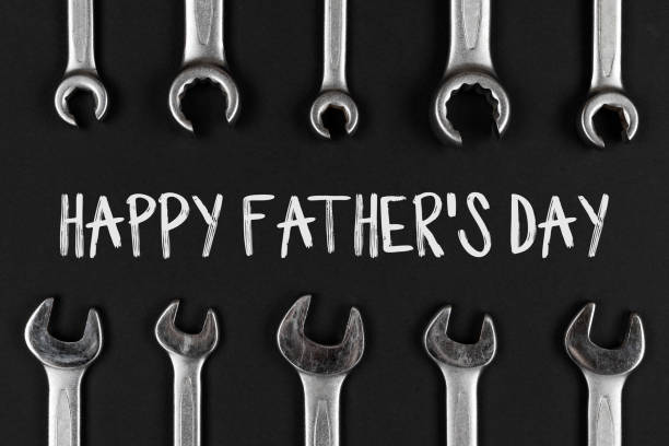istock Wrenches, spanners on black background. Happy fathers day concept 1397760936
