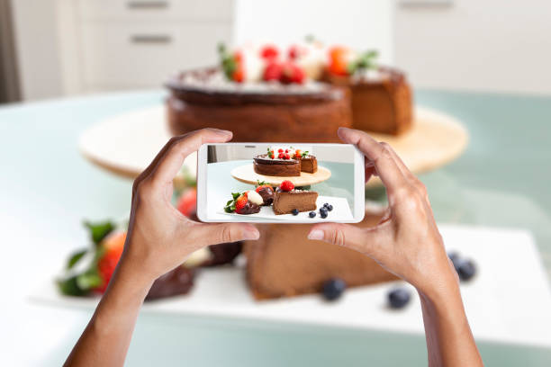 istock hands taking a picture of a cake 1397762617