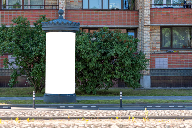 Blank public information board mock-up on the side of the street near a residential building Blank public information board mock up on the side of the street near a residential building advertising column stock pictures, royalty-free photos & images