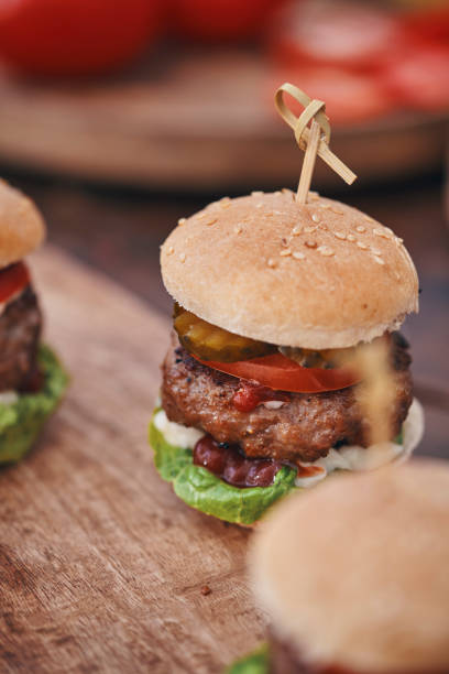 istock Mini Burgers with Beef Pattie, Tomato, Pickles and Lettuce 1397765880