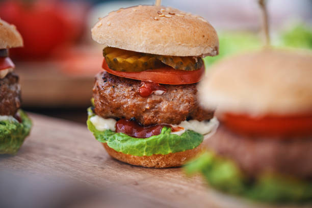 istock Mini Burgers with Beef Pattie, Tomato, Pickles and Lettuce 1397765882