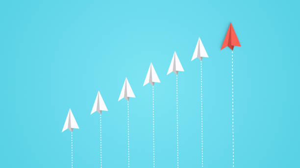 istock Group of the white paper planes and one different color 1397767997