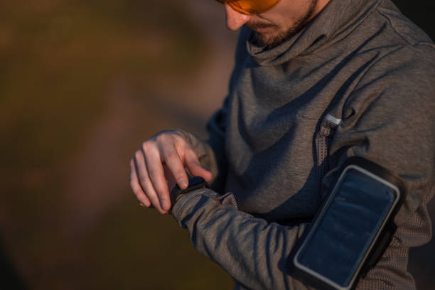 istock Young man working out / running outside by the river 1397768045