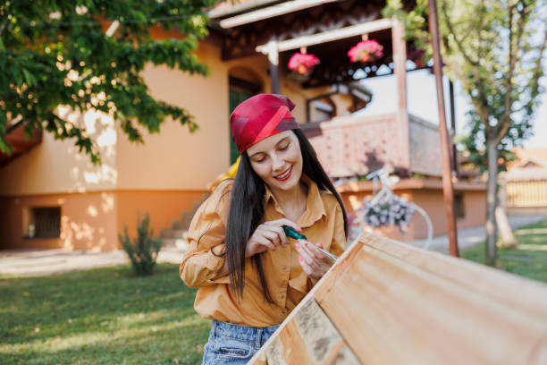 istock Handyman is assembling flat pack furniture with help of screwdriver 1397769565