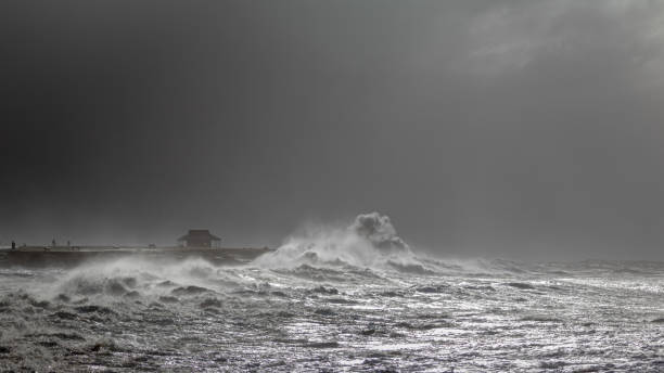istock Large wave crashes against coastline 1397772851