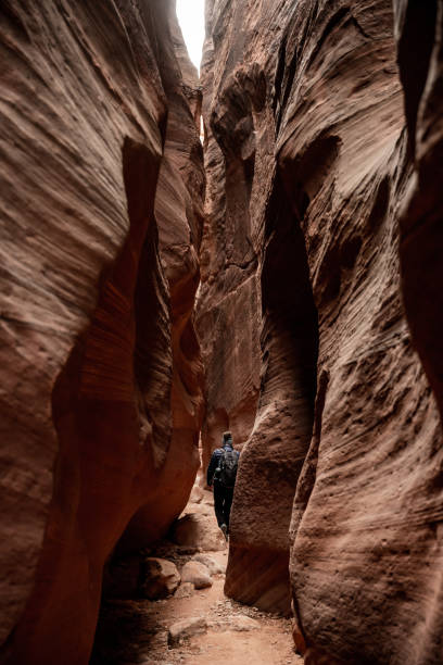 istock Hiker Walking Through Wire Pass Slot Canyon 1397776134