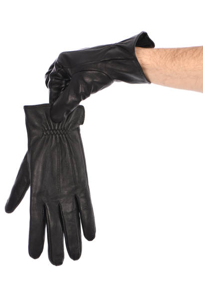 istock Man wearing black leather glove on white background, closeup. 1397778062