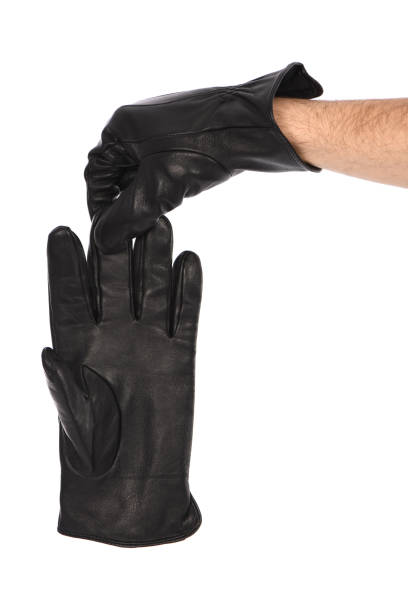 istock Man wearing black leather glove on white background, closeup. 1397778150