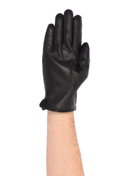 istock Man wearing black leather glove on white background, closeup. 1397778745