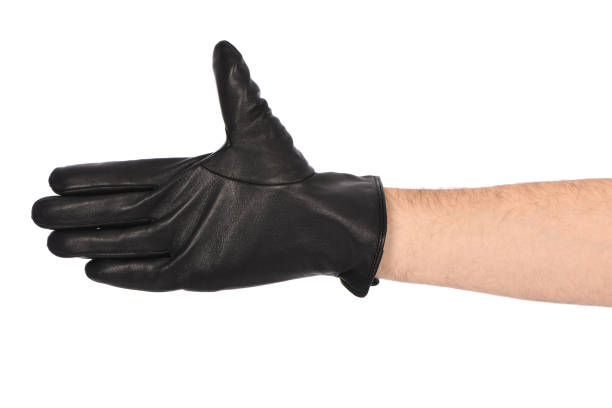 istock Man wearing black leather glove on white background, closeup. 1397778768