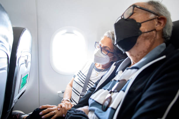 istock seniors traveling by air, asleep 1397778946