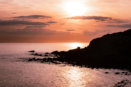Sunset lookoing towards Freshwater from St Catherine's Lighthouse, Niton, Isle of Wight, Hampshire, UK