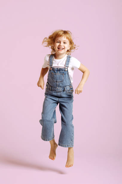 istock Baby girl posing on a pink background. 1397781236