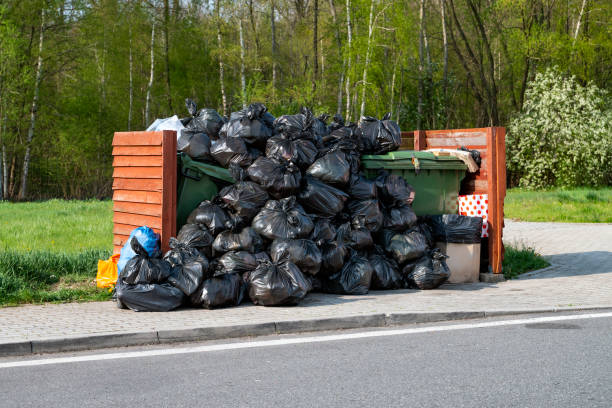 Overflowing rubbish containers and garbage bags Shot on overflowing rubbish containers and heap garbage bags on a public parking overflowing dumpster stock pictures, royalty-free photos & images