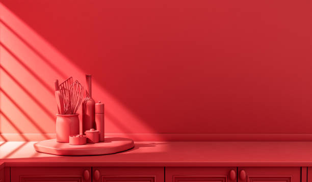istock Stylized single color red kitchen counter and everyday utensils in morning sunlight. 1397787798