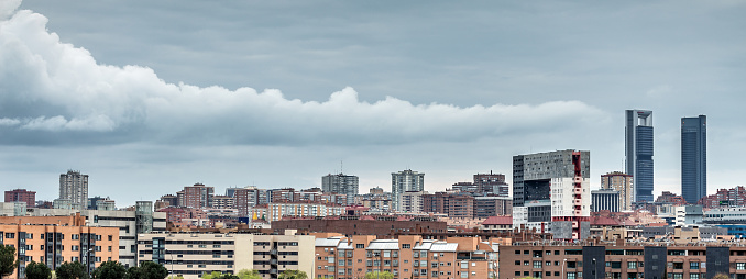 Madrid, Spain. March 26 2022. Elongated storm cloud spreads across the sky over Madrid\
