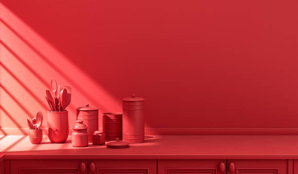 istock Stylized single color red kitchen counter and everyday utensils in morning sunlight. 1397788205