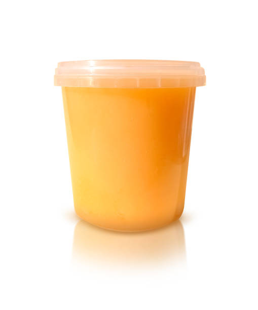 istock Jar of honey isolated on a white background 1397789033