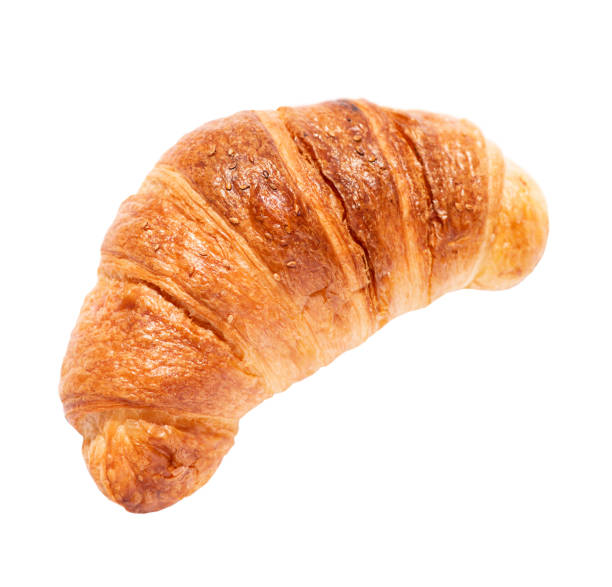 istock One french croissant closeup isolated on white background. 1397789063