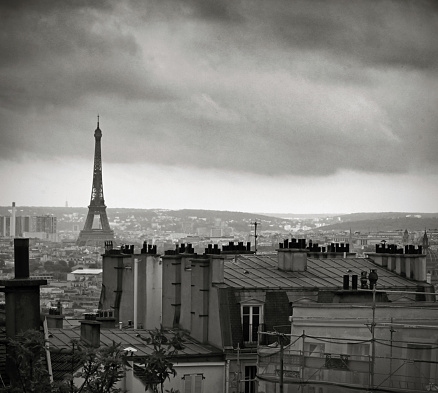 Aerial scenic view of Paris with the Eiffel tower and la Defense business district skyline, black and white