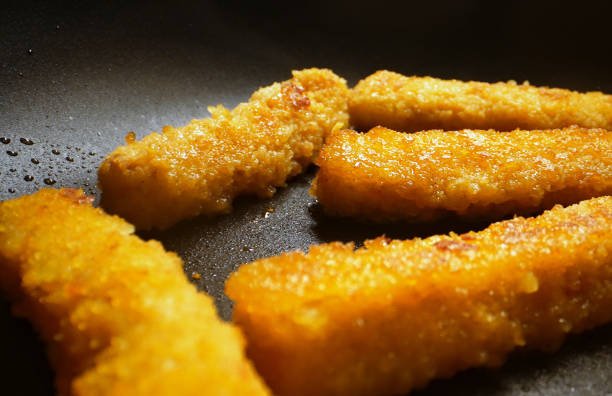 istock Chicken nuggets frying in a pan. 1397789299
