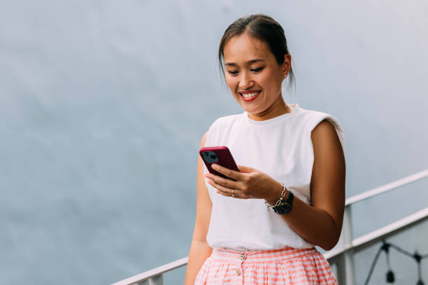 istock A Beautiful Businesswoman Smiling While Looking At Her Mobile 1397789929