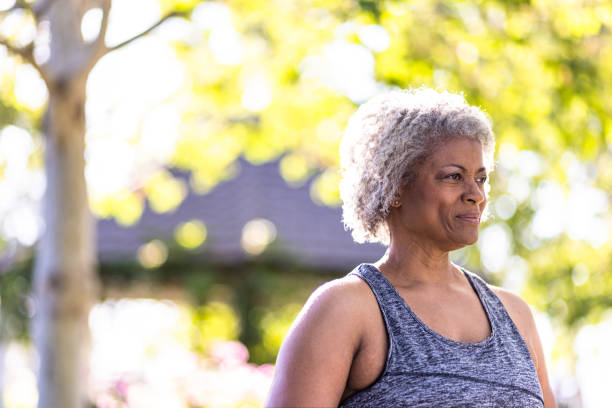 istock Senior black woman stretching and working out with weights 1397790455