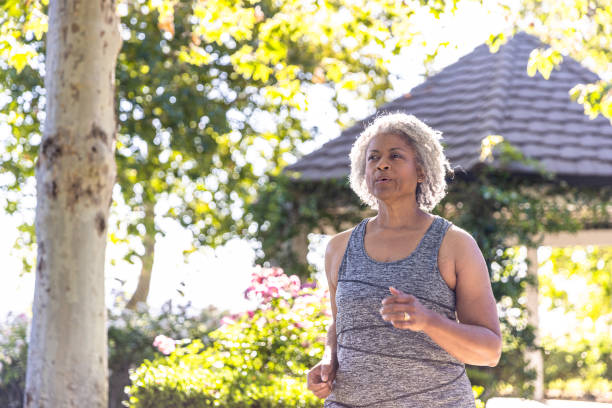 istock Senior black woman jogging 1397790490
