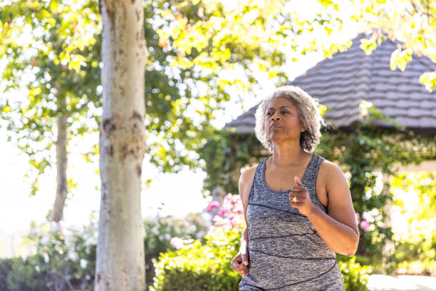 istock Senior black woman jogging 1397790493