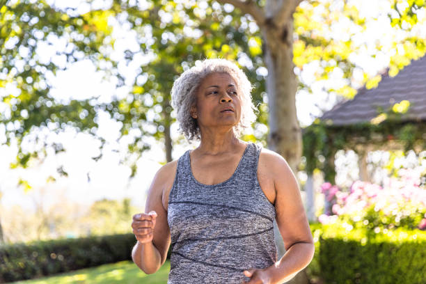 istock Senior black woman jogging 1397790496
