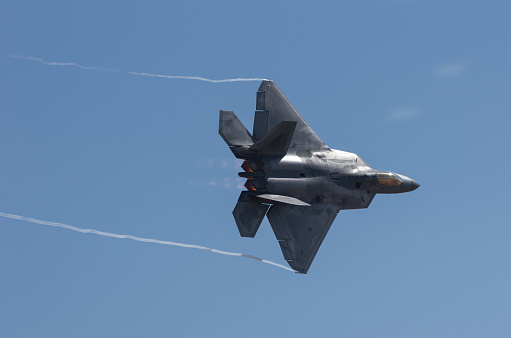 Chino Airport, California, USA - May 3, 2015: Lockheed Martin F-22 Raptor flight demo. The F-22 is a fifth-generation, twin-engine, stealth tactical fighter aircraft developed for the USAF.