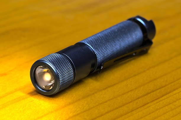 istock Flashlight lies on the surface of the table 1397792706