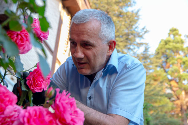 istock Man gardening his backyard with flowers 1397797274