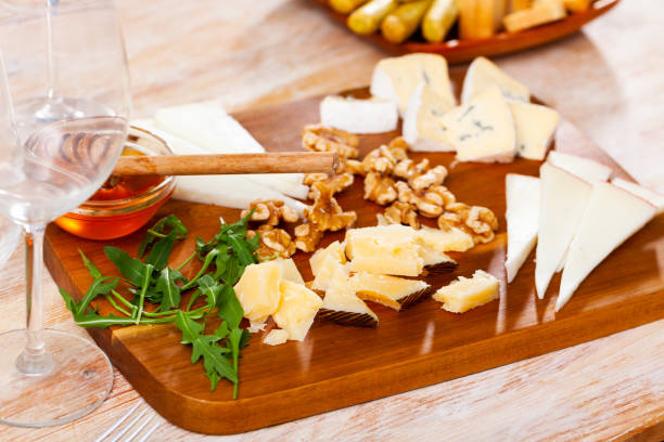 istock Various types of cheese on wooden board 1397797301