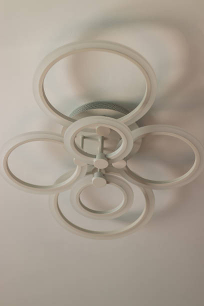 istock Suspended white LED chandelier that lights up with remote control 1397797635