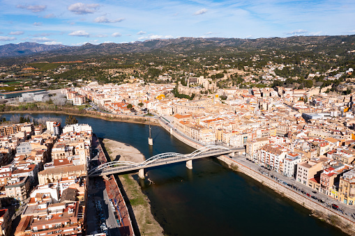 Cityscape of Tortosa, comarca of Baix Ebre, Catalonia, Spain. View of residential buildings along Ebro River.