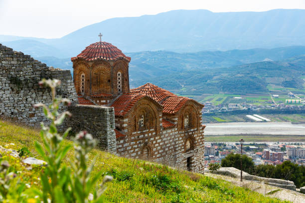 Medieval Holy Trinity Church on hill in Berat city in spring Medieval Byzantine Holy Trinity Church standing on hill in Berat city of Southern Albania on sunny spring day berat stock pictures, royalty-free photos & images