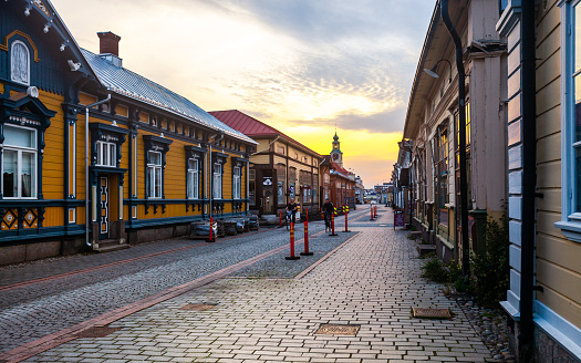 Rauma, Finland  -  A few people on the main street of old town  wooden buildings district.